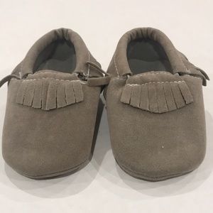 Mocassin style slippers. Unmarked unbranded.